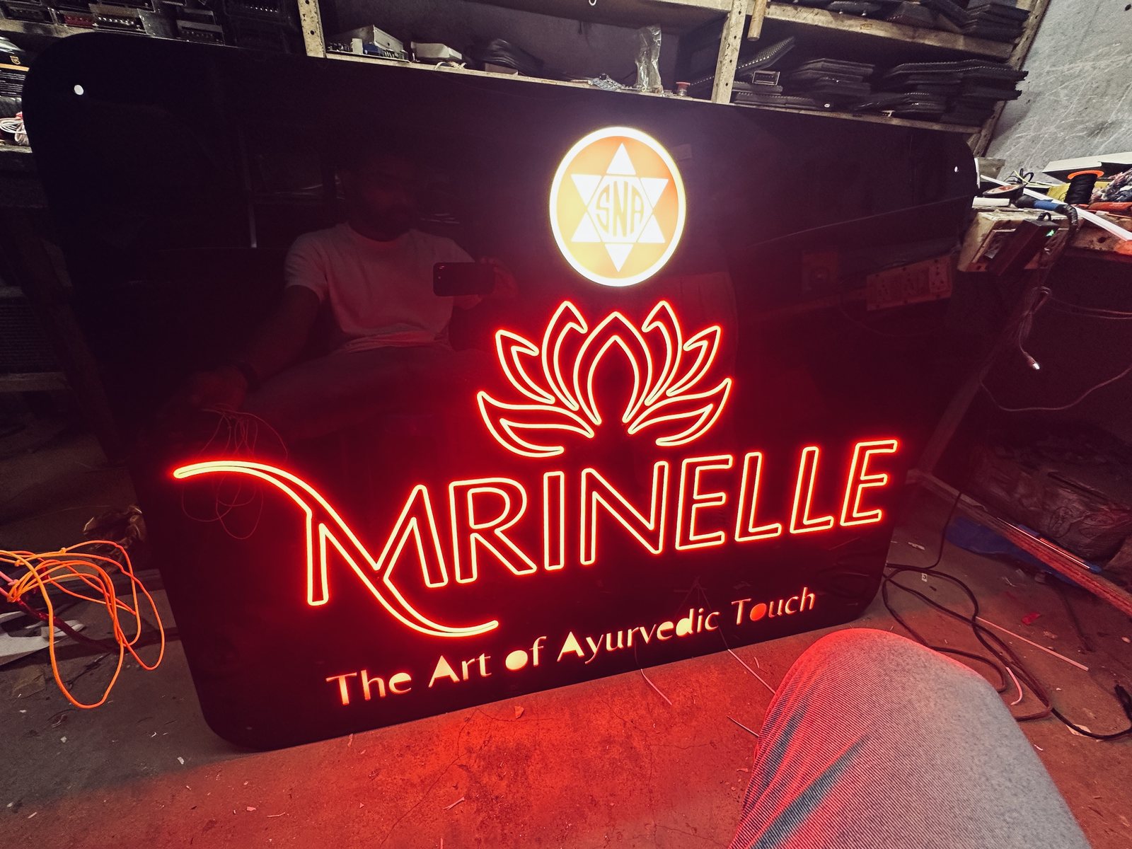Marinelle red neon brand logo sign